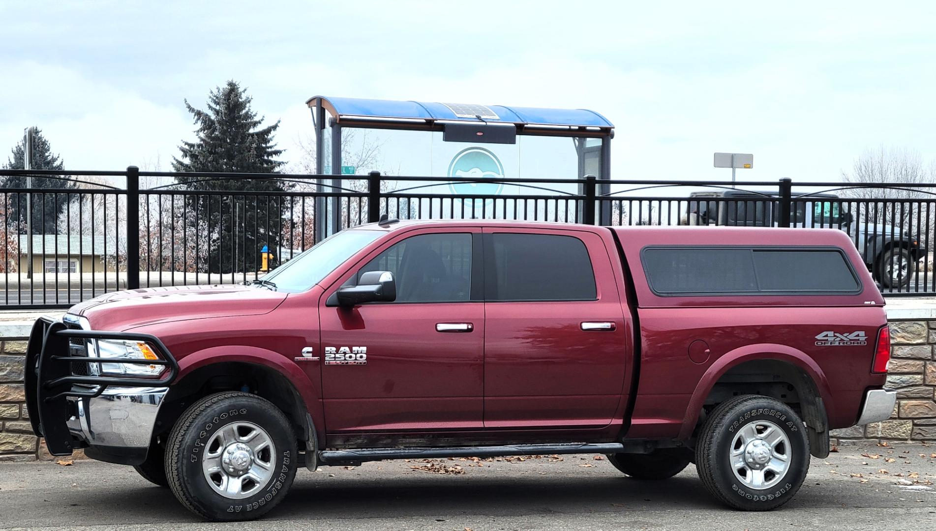 2018 Maroon /Black RAM 2500 SLT (3C6UR5DL4JG) with an 6.7 L Cummins Turbo Diesel engine, 6-Speed Automatic transmission, located at 450 N Russell, Missoula, MT, 59801, (406) 543-6600, 46.874496, -114.017433 - Only 12,839 Miles. Mint Condition/ 4 Wheel Drive. 6.7L Cummins Turbo Diesel. 6 Speed Automatic Transmission. Matching Topper. Touchscreen Display. AM FM Bluetooth. Power Drivers Seat. Air. Cruise. Tilt. Power Windows and Locks. Backup Camera. - Photo#0